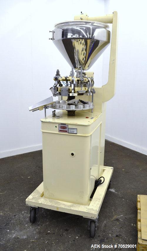 Used Kalix Automatic Metal Tube Filling Machine, Model KX-60. Capacity up to 50 tubes per minute. Maximum tube dimensions: 1-1/2" or 40mm diameter x 7" or 200mm height. Filling range: 2cc to 162cc wi...