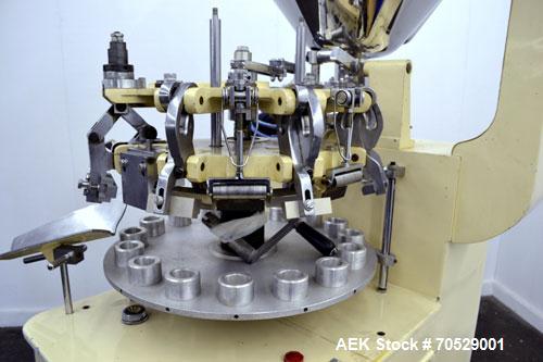 Used Kalix Automatic Metal Tube Filling Machine, Model KX-60. Capacity up to 50 tubes per minute. Maximum tube dimensions: 1-1/2" or 40mm diameter x 7" or 200mm height. Filling range: 2cc to 162cc wi...