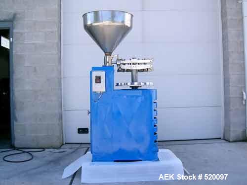 USED: Kalix model RV-7 tube filler. Includes pump for products up to approximately 150,000 cps, double reverse saddleback crimping station, jaw equipment with a slot to accept number bar to batch cod...