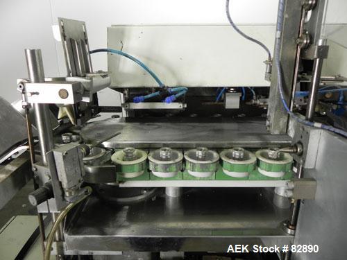 Used Arenco Model AM2000 Twin Piston Laminate Tube Filler. Currently equipped with high frequency sealer. Tubes are fed automatically through a dual tube magazine. Stations include tube cleaning, tub...