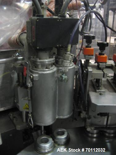 Used IWKA Plastic/Laminate Tube Filler, Model TU 200. IWKA TZ101 automatic tube feeder; speeds of up to 250 tubes per minute. Stainless steel product feed hopper. Tube registration station. Dual fill...