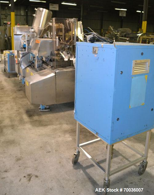 Used Norden Dual Head High Speed Tube Filler, Model NM 2000 HF for laminate tubes. Capable of 200 tubes per minute. Includes tube cleaning, cassette tube infeed, registration, and trimmer. Fill volum...