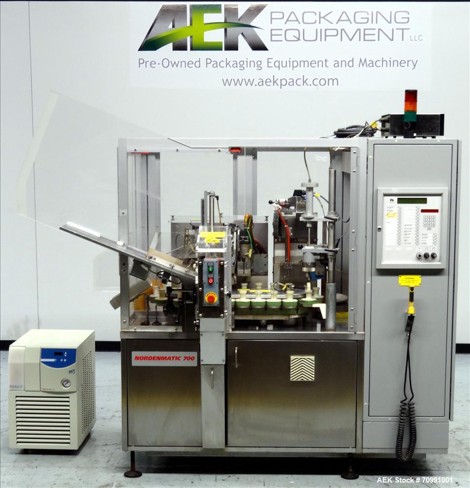 Used Norden Model NM 700 HA Hot Air Plastic Tube Filler. Capable of speeds up to 70 tubes per minute. General Fill volume range: 1ml - 300ml. Tube size range: (Length) 50mm - 250mm (Diam) 10mm - 60mm...