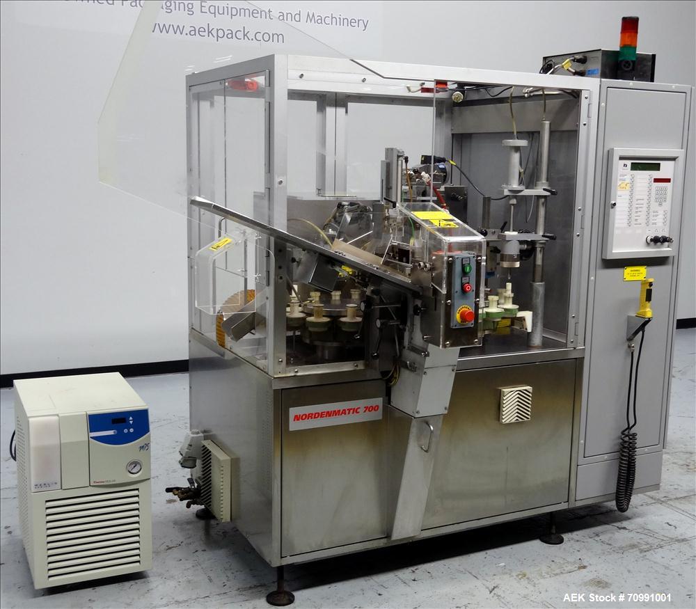 Used Norden Model NM 700 HA Hot Air Plastic Tube Filler. Capable of speeds up to 70 tubes per minute. General Fill volume range: 1ml - 300ml. Tube size range: (Length) 50mm - 250mm (Diam) 10mm - 60mm...