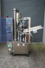 Used Axiomatic Model Optima 700 Axomatic Tube Filler. 7 Station, water cooled hot jaws, hopper with agitator, maximum speed of 2,500 pieces/hour, automatic tube positioning, fixed nozzle with bush-ra...