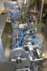 Used Norden Dual Head High Speed Tube Filler, Model NM 2000 HF for laminate tubes. Capable of 200 tubes per minute. Includes tube cleaning, cassette tube infeed, registration, and trimmer. Fill volum...
