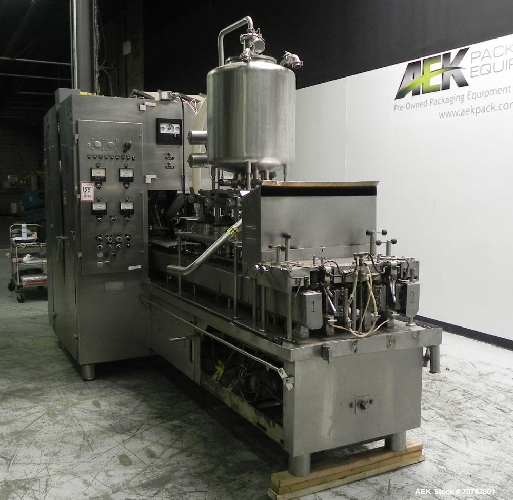 Used Cherry Burrell / Evergreen Q7 Gable Top Form fill seal carton filling machine, Model Q-7, Serial #4173, Handles 1/2 Pint, Pint and Quart Cartons. now set for quart 2-3/4 x 2-3/4 x 6-1/2" quart c...