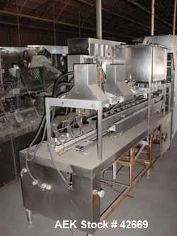 Used Haskon Inline Carton Filler, Model 540UES. Stainless steel clad frame. Sanitary contact parts. Designed to form, fill, seal liquid products using gravity type filling. Set for 1/2 gallons. (4) f...