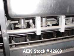 Used Haskon Inline Carton Filler, Model 540UES. Stainless steel clad frame. Sanitary contact parts. Designed to form, fill, seal liquid products using gravity type filling. Set for 1/2 gallons. (4) f...