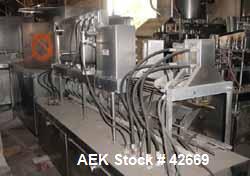 Used Haskon Inline Carton Filler, Model 540UES. Stainless steel clad frame. Sanitary contact parts. Designed to form, fill, seal liquid products using gravity type filling. Set for 1/2 gallons. (4) f...