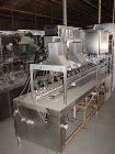 Used Haskon Inline Carton Filler, Model 540UES. Stainless steel clad frame. Sanitary contact parts. Designed to form, fill, seal liquid products using gravity type filling. Set for 1/2 gallons. (4) f...
