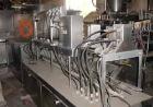 Used Haskon Inline Carton Filler, Model 540UES. Stainless steel clad frame. Sanitary contact parts. Designed to form, fill, seal liquid products using gravity type filling. Set for 1/2 gallons. (4) f...