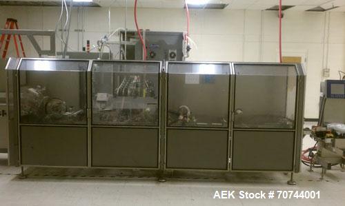 Used Cloud 2-1/2" Pitch ServOriginal High Speed Pouch Machine. 2500 Pouches per minute, set up on 2 1/2" centers and includes a Z-Automation model CH9-041 cartoner. Accommodates 24" rolls x 14"wide o...