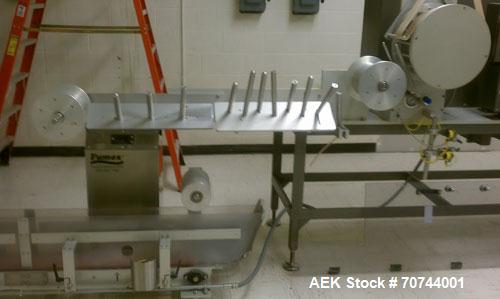 Used Cloud 2-1/2" Pitch ServOriginal High Speed Pouch Machine. 2500 Pouches per minute, set up on 2 1/2" centers and includes a Z-Automation model CH9-041 cartoner. Accommodates 24" rolls x 14"wide o...