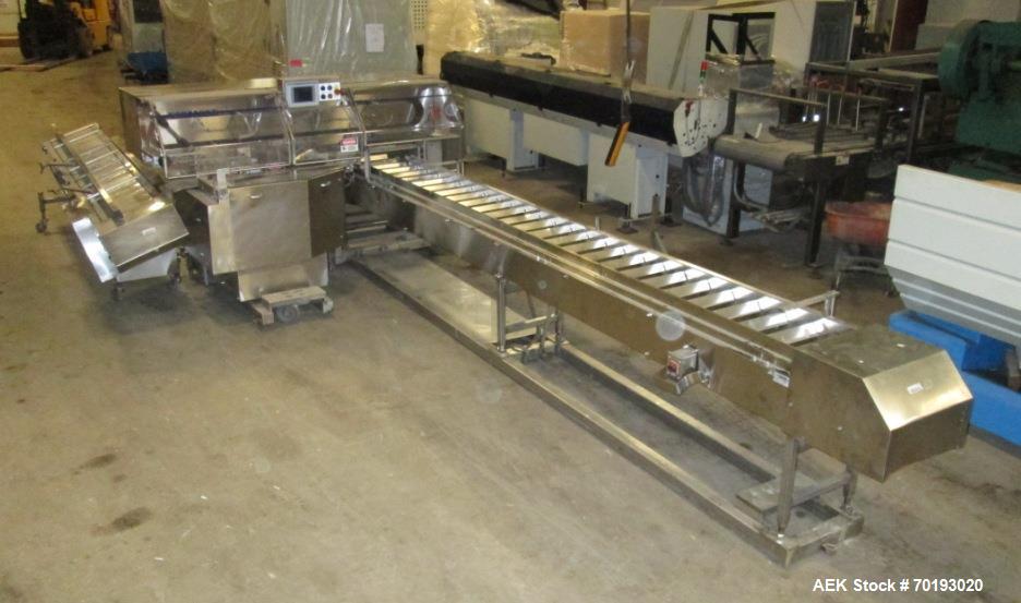 Used Formost GTS-4 Stainless Steel Bagger, Model GTS-4 LH. 86” Frame. Stainless steel construction. Rotary bag feed. 15’ front infeed bucket conveyor. 10’ rear discharge conveyor. Allen Bradley contr...