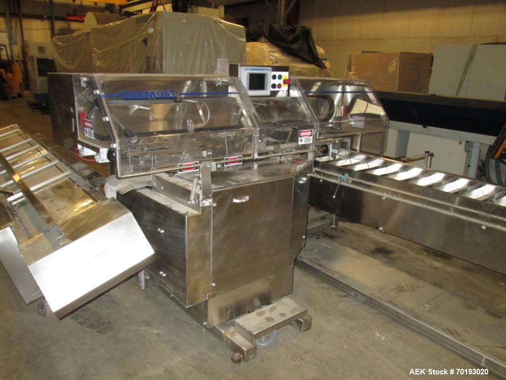 Used Formost GTS-4 Stainless Steel Bagger, Model GTS-4 LH. 86” Frame. Stainless steel construction. Rotary bag feed. 15’ front infeed bucket conveyor. 10’ rear discharge conveyor. Allen Bradley contr...