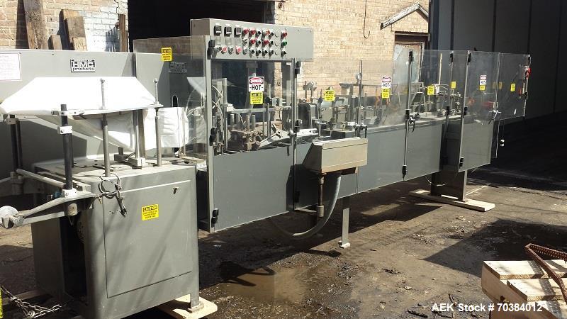 Used HMC/Bartelt IM10-10 Poucher, Model - IM 10-10. Bartelt horizontal style poucher. Right hand machine with four point plow, dual rockers and standard film feed rollers . 10" centers with single mo...