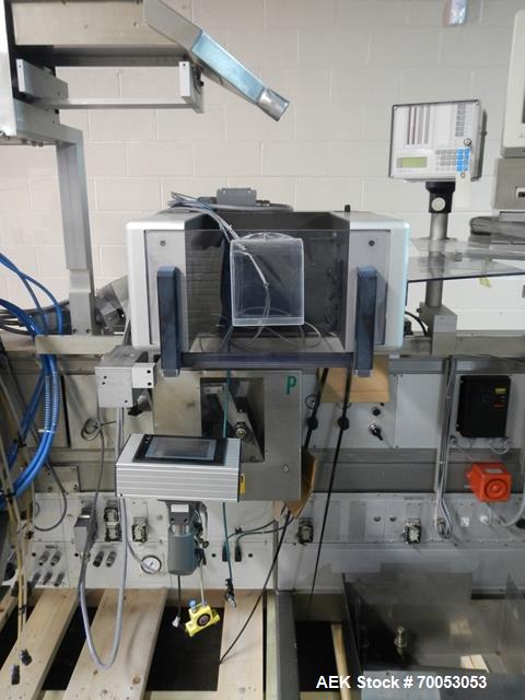 Used One (1) used Uhlmann thermoforming blister packaging machine, model UPS3, with Aylward feeder, Neslab chiller, full controls, reject station, serial# 189, built 1988.