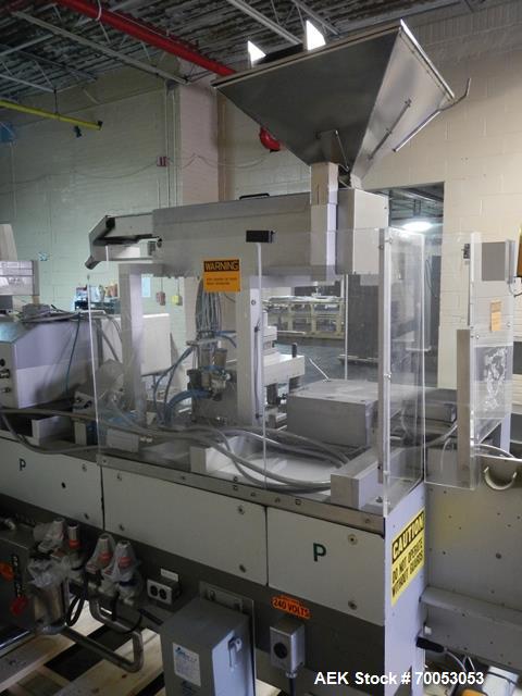 Used One (1) used Uhlmann thermoforming blister packaging machine, model UPS3, with Aylward feeder, Neslab chiller, full controls, reject station, serial# 189, built 1988.