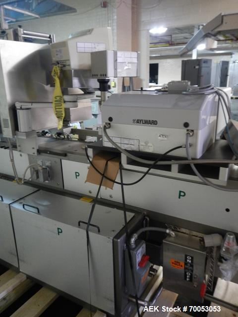Used One (1) used Uhlmann thermoforming blister packaging machine, model UPS3, with Aylward feeder, Neslab chiller, full controls, reject station, serial# 189, built 1988.