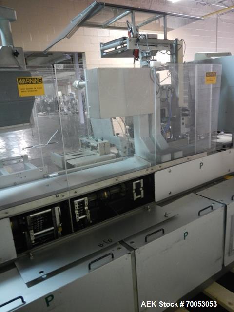 Used One (1) used Uhlmann thermoforming blister packaging machine, model UPS3, with Aylward feeder, Neslab chiller, full controls, reject station, serial# 189, built 1988.