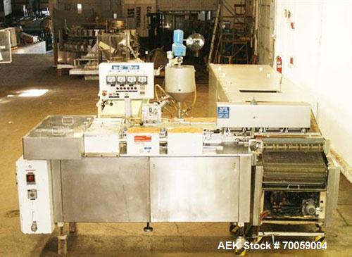 Used Bosch Servac Model 300S High Speed Form Fill Seal Suppository Machine, 300 ppm. Unit takes two rolls of foil film and forms, then fills, the pocket into a bullet shape suppository and cuts it in...