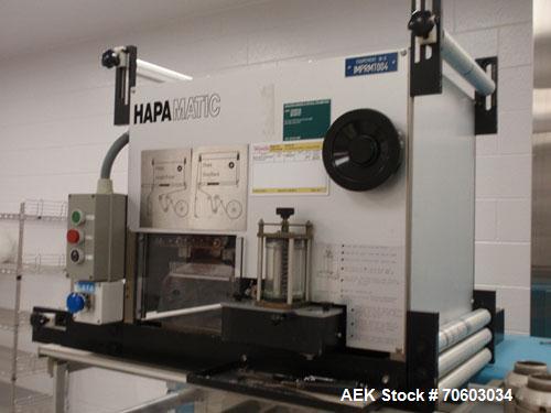 Used Uhlmann Thermoforming Blister Packaging Machine, Model UPS300. Currently running a 150mm x 120mm card, with Hapamatic foil printer, Neslab process chiller, 480 volt, serial# 552.