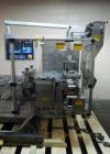 Used One (1) used Uhlmann thermoforming blister packaging machine, model UPS3, with Aylward feeder, Neslab chiller, full controls, reject station, serial# 189, built 1988.