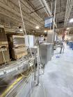 Used Combibloc (Sig) Model 112-32 Aseptic Brick Pack Cartoning Lines. The fillers are capable of running 125 ml, 150 ml, 200 ml or 250 ml cartons (with changeparts). Has Sig Beckhoff HMI with Siemens...
