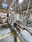 Used Combibloc (Sig) Model 112-32 Aseptic Brick Pack Cartoning Lines. The fillers are capable of running 125 ml, 150 ml, 200 ml or 250 ml cartons (with changeparts). Has Sig Beckhoff HMI with Siemens...