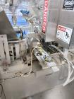 Used Combibloc (Sig) Model 112-32 Aseptic Brick Pack Cartoning Lines. The fillers are capable of running 125 ml, 150 ml, 200 ml or 250 ml cartons (with changeparts). Has Sig Beckhoff HMI with Siemens...