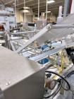 Used Combibloc (Sig) Model 112-32 Aseptic Brick Pack Cartoning Lines. The fillers are capable of running 125 ml, 150 ml, 200 ml or 250 ml cartons (with changeparts). Has Sig Beckhoff HMI with Siemens...