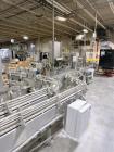 Used Combibloc (Sig) Model 112-32 Aseptic Brick Pack Cartoning Lines. The fillers are capable of running 125 ml, 150 ml, 200 ml or 250 ml cartons (with changeparts). Has Sig Beckhoff HMI with Siemens...