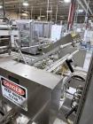 Used Combibloc (Sig) Model 112-32 Aseptic Brick Pack Cartoning Lines. The fillers are capable of running 125 ml, 150 ml, 200 ml or 250 ml cartons (with changeparts). Has Sig Beckhoff HMI with Siemens...
