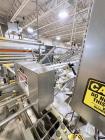Used Combibloc (Sig) Model 112-32 Aseptic Brick Pack Cartoning Lines. The fillers are capable of running 125 ml, 150 ml, 200 ml or 250 ml cartons (with changeparts). Has Sig Beckhoff HMI with Siemens...