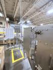 Used Combibloc (Sig) Model 112-32 Aseptic Brick Pack Cartoning Lines. The fillers are capable of running 125 ml, 150 ml, 200 ml or 250 ml cartons (with changeparts). Has Sig Beckhoff HMI with Siemens...