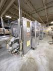 Used Combibloc (Sig) Model 112-32 Aseptic Brick Pack Cartoning Lines. The fillers are capable of running 125 ml, 150 ml, 200 ml or 250 ml cartons (with changeparts). Has Sig Beckhoff HMI with Siemens...