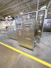 Used Combibloc (Sig) Model 112-32 Aseptic Brick Pack Cartoning Lines. The fillers are capable of running 125 ml, 150 ml, 200 ml or 250 ml cartons (with changeparts). Has Sig Beckhoff HMI with Siemens...