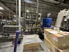 Used Combibloc (Sig) Model 112-32 Aseptic Brick Pack Cartoning Lines. The fillers are capable of running 125 ml, 150 ml, 200 ml or 250 ml cartons (with changeparts). Has Sig Beckhoff HMI with Siemens...