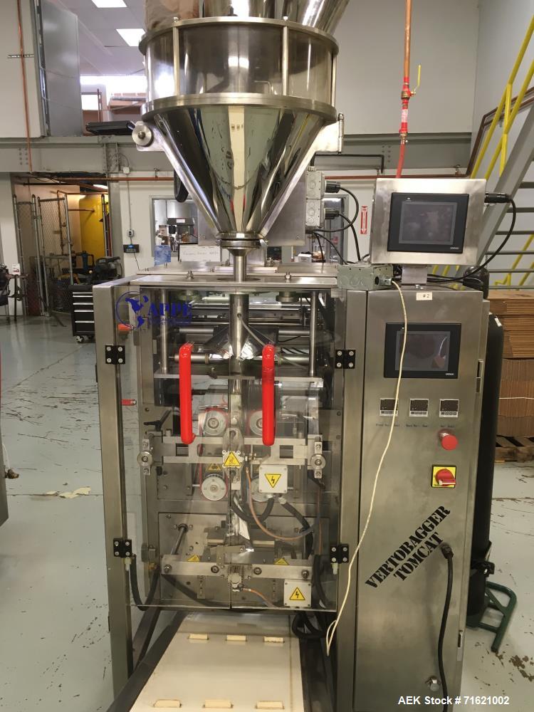 Used American Packaging and Plant Equipment Vertobagger Tomcat Machine. 50 Liter Hopper, 20g-1500g fill weight, Servo motor, 4.8 Nm. PLC with full color touch-screen controller. Agitation drive 0.2 k...