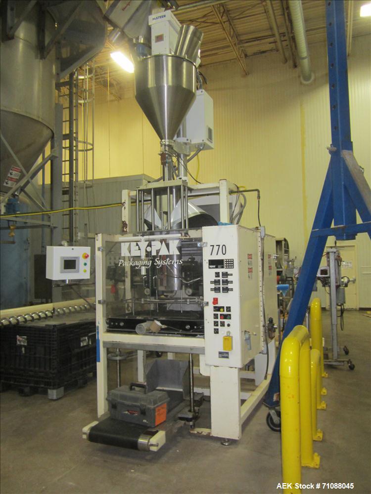 Used Key-Pak Model V400S vertical form fill seal machine. Bag size range: (Width) 6" - 15" (Length) 6" - 30". Has Markem hot stamp coder, side belt pull down, static eliminator,  registration and Mat...