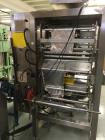 Used American Packaging & Plant Equipment VertoBagger Falcon BrickPack Machine. Vacuum brick bag, 8-15 bags/min, bag length 2-11