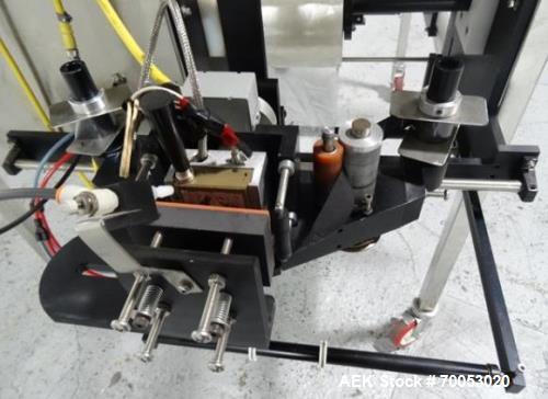 Used Phoenix Engineering Form / Fill and Seal Unit, Model GOPACKER1000. Set up with dual drop disc counter/filler for solid disage capsule or tablet products.  Vertical orientation, 1" wide x 2" long...