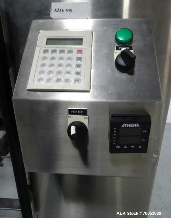 Used Phoenix Engineering Form / Fill and Seal Unit, Model GOPACKER1000. Set up with dual drop disc counter/filler for solid disage capsule or tablet products.  Vertical orientation, 1" wide x 2" long...