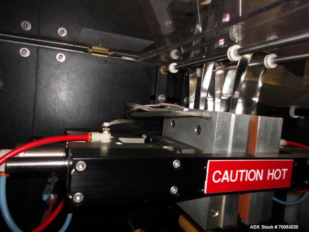 Used Phoenix Engineering Form / Fill and Seal Unit, Model GOPACKER1000. Set up with dual drop disc counter/filler for solid disage capsule or tablet products.  Vertical orientation, 1" wide x 2" long...