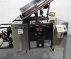 Used Phoenix Engineering Form / Fill and Seal Unit, Model GOPACKER1000. Set up with dual drop disc counter/filler for solid disage capsule or tablet products.  Vertical orientation, 1