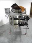 Used Phoenix Engineering Form / Fill and Seal Unit, Model GOPACKER1000. Set up with dual drop disc counter/filler for solid disage capsule or tablet products.  Vertical orientation, 1