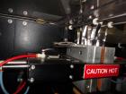 Used Phoenix Engineering Form / Fill and Seal Unit, Model GOPACKER1000. Set up with dual drop disc counter/filler for solid disage capsule or tablet products.  Vertical orientation, 1