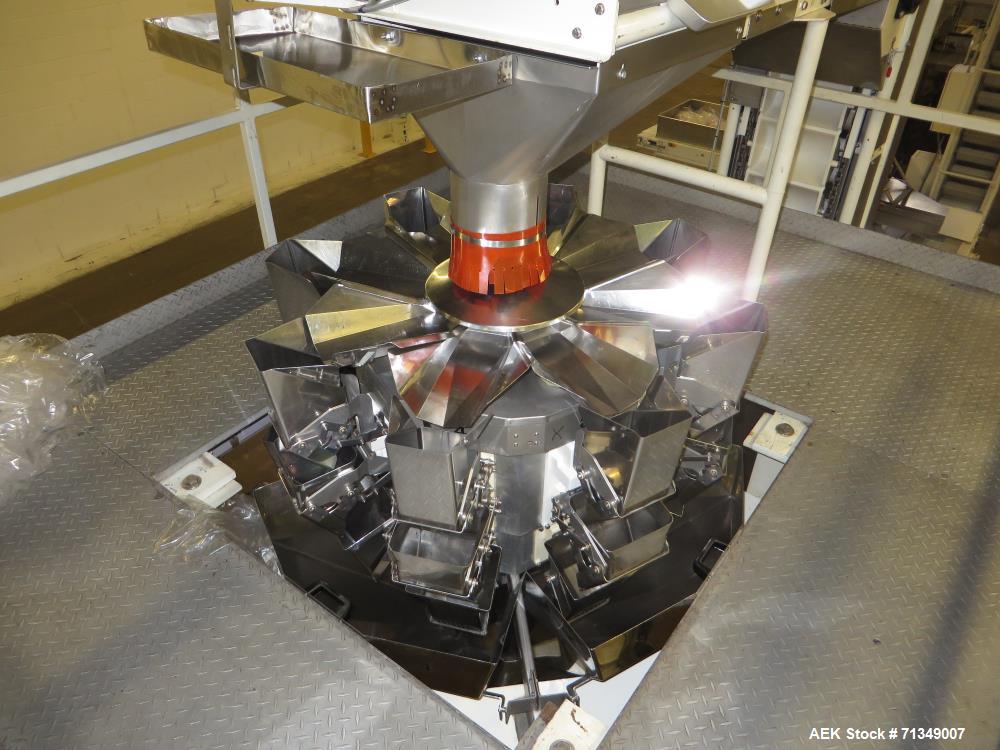 Used Hayssen Model 300E Vertical form fill and seal packaging system. Complete line includes with Ishida 16 head dimpled/embossed bucket scale  , Allen-Bradley Compact Logix L31 controls,  mild steel...