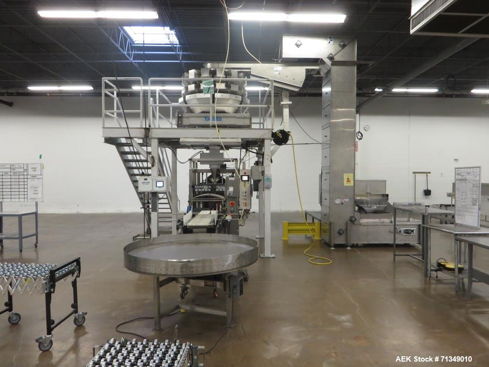 Used-Matrix Packaging  Model  201318R  Vertical form fill and seal packaging system. Complete line includes Yamato Adw-714sv...